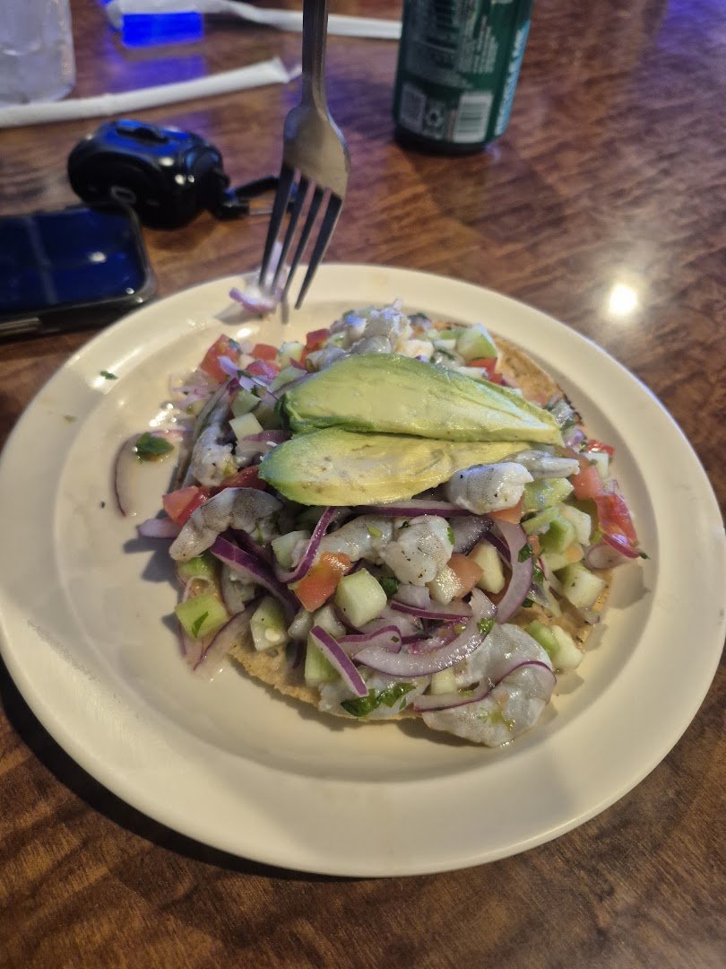 Colorful Mexican plates on a casual dining table.